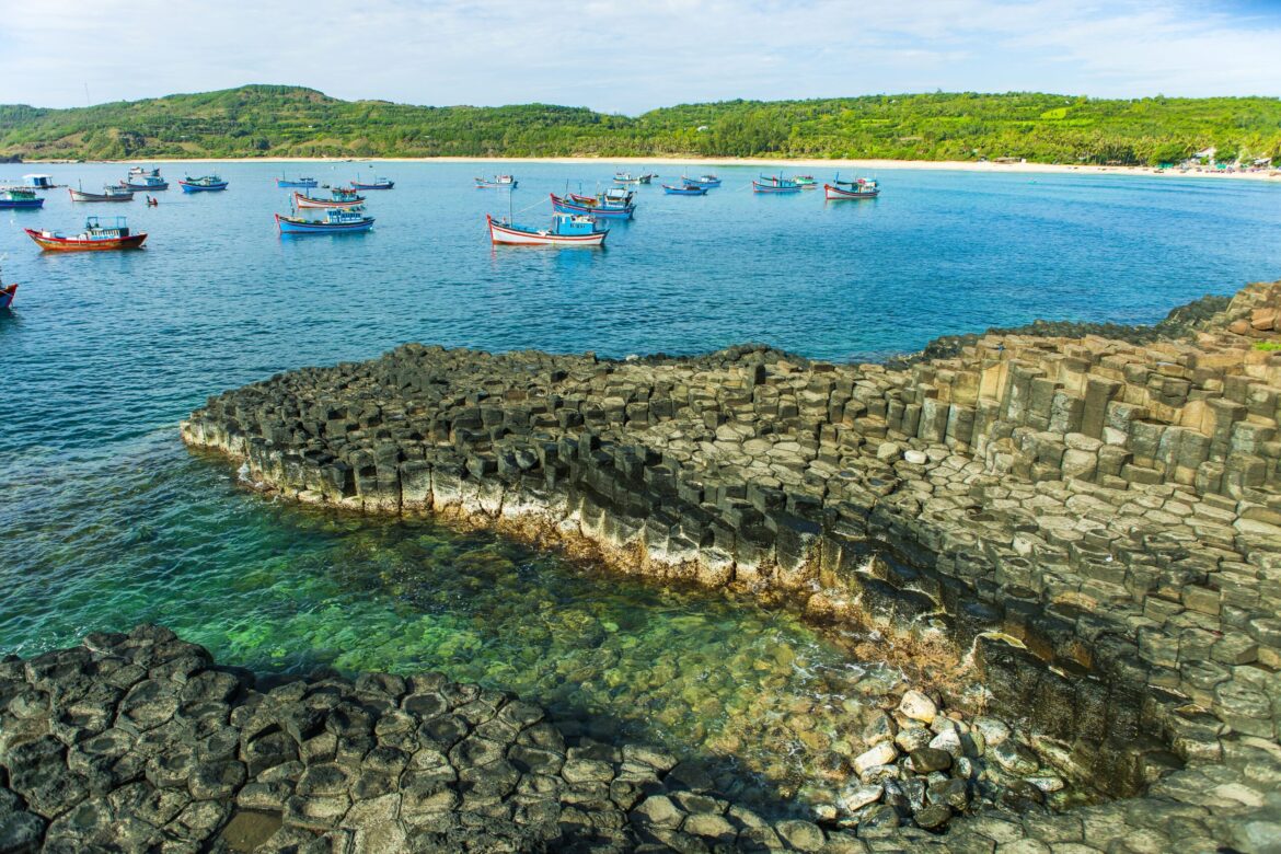 Ganh Da Dia, Phu Yen, Viet Nam, masterpiece of nature, wonderful, fantastic heritage, abstract place for Vietnam travel, rock make great terrain, boat on sea make beauty landscape of ganhdadia. Discovery Vietnam Travel so beautiful