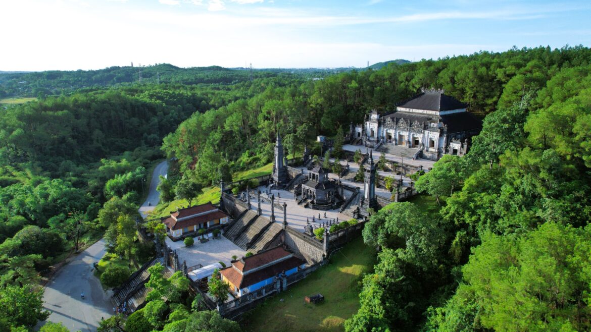 Aerial view of Khai Dinh Tomb nestled in the forested hills of Hue, Vietnam